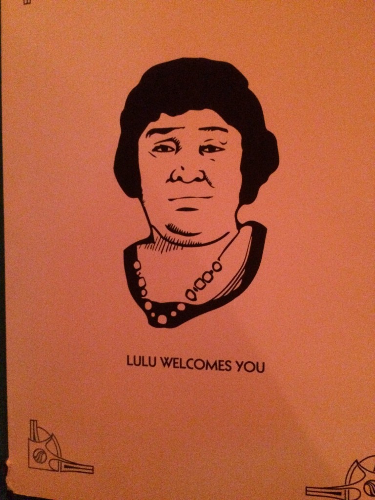 Paper reading "Lulu Welcomes You" with picture of lulu