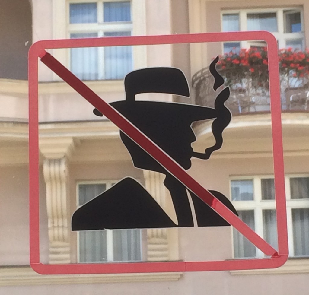 Man in fedora with cross-out not allowed sign